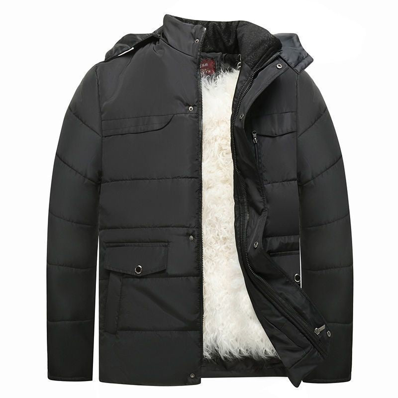 Giacca invernale nera imbottita, con cappuccio e fodera in pelliccia sintetica bianca, ideale per il freddo. Design moderno e funzionale.