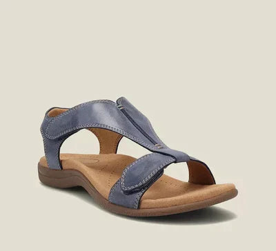 Sandalo da donna in pelle blu con suola ergonomica marrone, design aperto e cinturino regolabile. Calzature estive comode e alla moda.