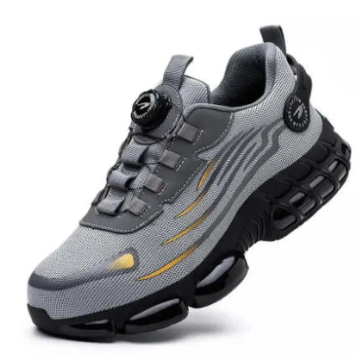 Scarpa sportiva grigia con suola ammortizzata nera, design moderno e dettagli gialli. Ideale per corsa e fitness. Scarpe da ginnastica uomo.
