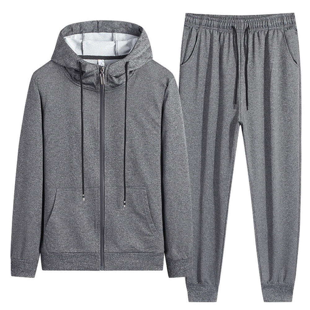 Tuta sportiva grigia in due pezzi, con felpa con cappuccio e pantaloni con coulisse. Abbigliamento casual unisex, ideale per palestra e tempo libero.