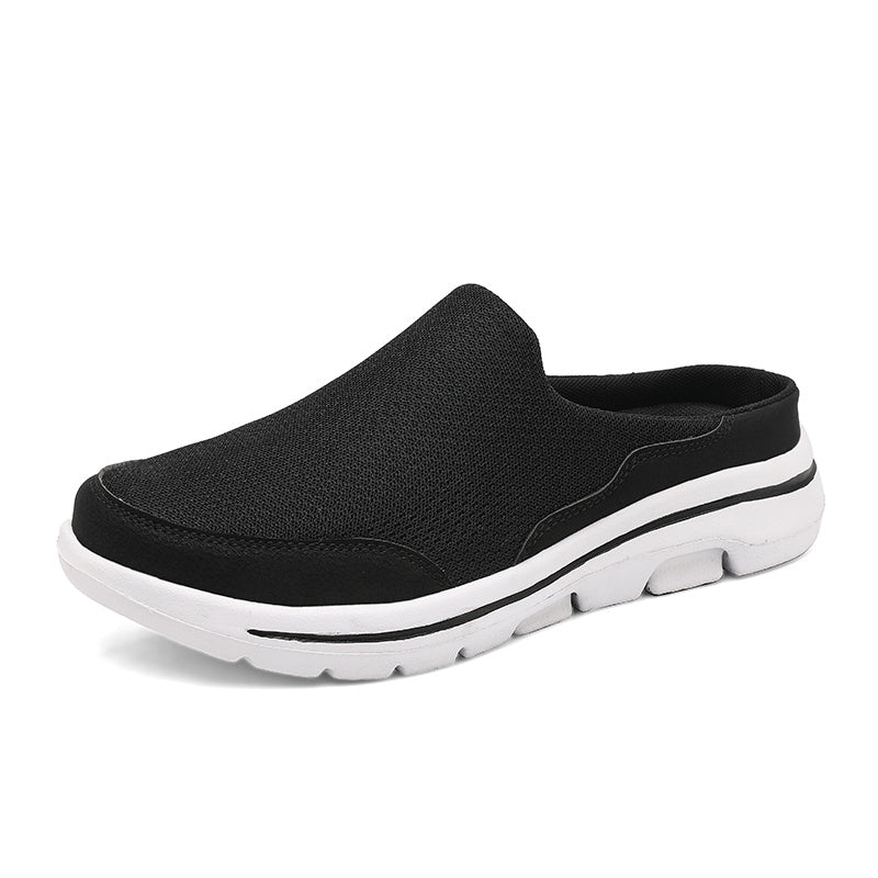 Scarpa slip-on nera da uomo con suola bianca, design casual e traspirante, ideale per passeggiate e tempo libero. Scarpe comode e leggere.