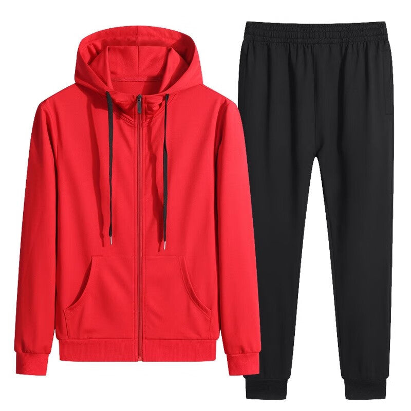 Tuta sportiva uomo: felpa rossa con cappuccio e pantaloni neri. Abbigliamento casual, comodo per palestra e tempo libero.