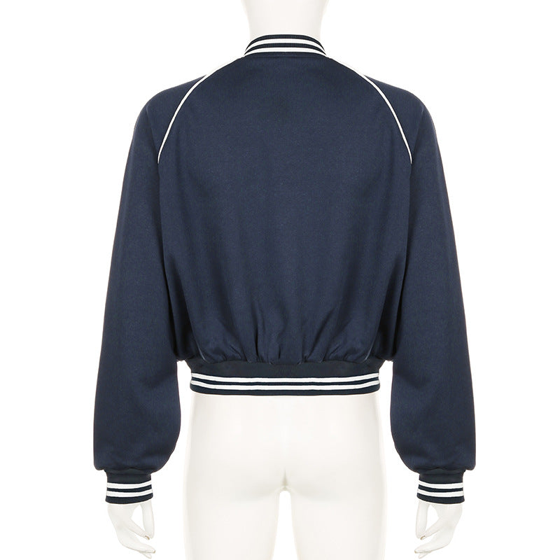 Giacca bomber blu scuro da donna, vista posteriore, con colletto e polsini a righe bianche. Design casual e sportivo, ideale per moda autunnale.