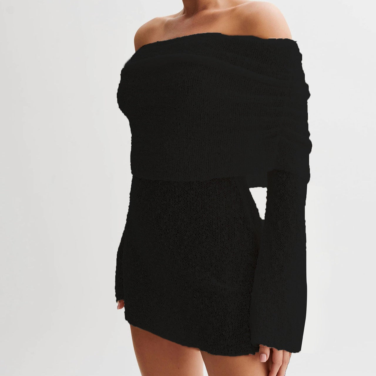 Abito nero elegante a spalle scoperte, maniche lunghe, tessuto aderente. Moda femminile, stile sofisticato, abbigliamento da sera.