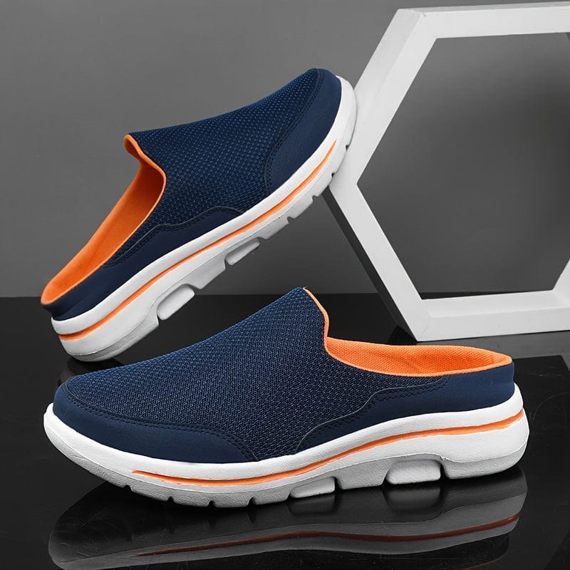 Scarpe slip-on blu e arancioni su sfondo grigio, design sportivo con suola bianca antiscivolo. Calzature casual comode per uomo.