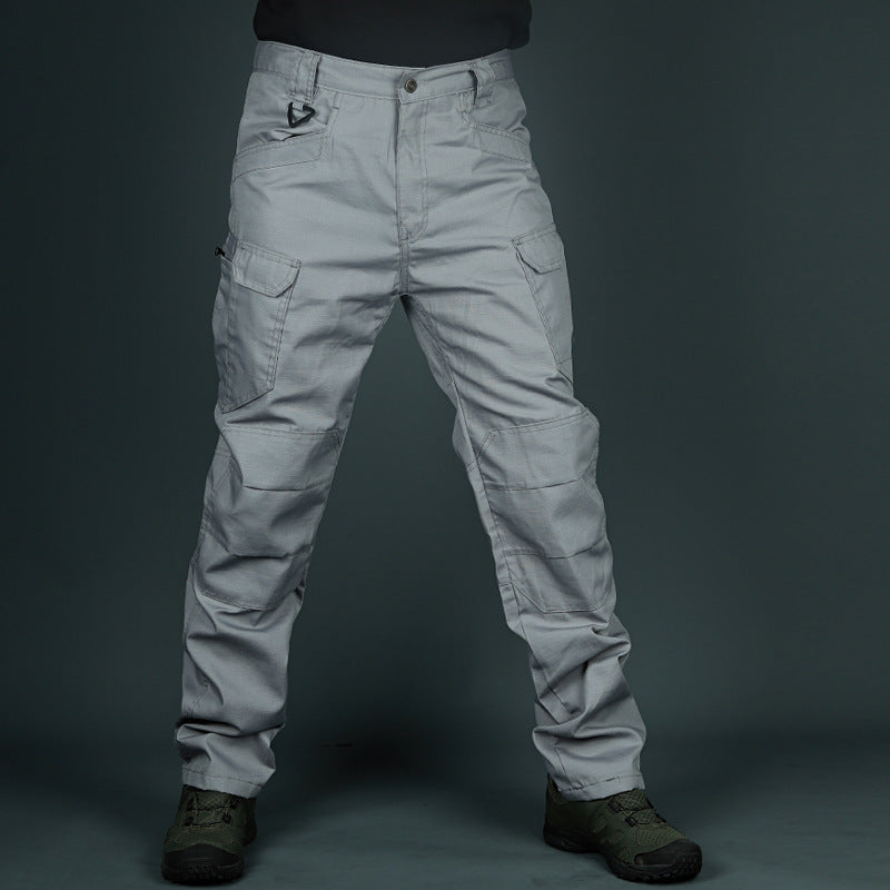 Pantaloni cargo grigi da uomo, tasche multiple, stile militare, tessuto resistente, ideali per outdoor e attività tattiche.