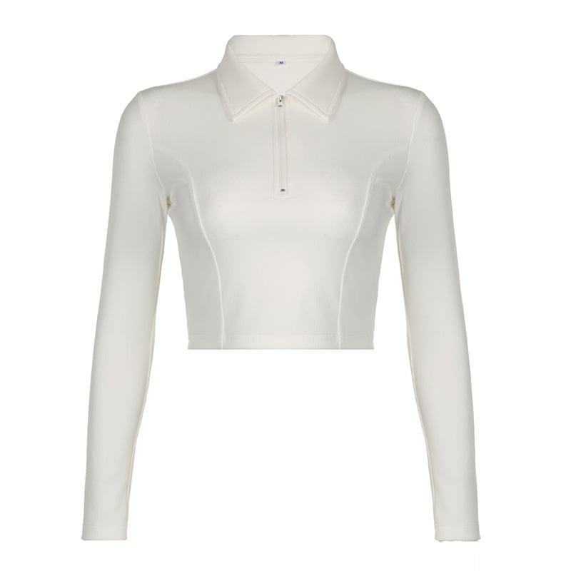 Camicia bianca a maniche lunghe da donna, stile cropped, con colletto classico e zip frontale. Moda femminile, abbigliamento casual elegante.