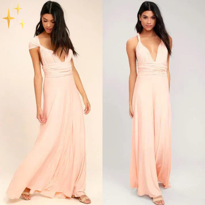 Abito lungo elegante rosa chiaro con scollo a V profondo, spalline sottili e gonna fluida. Perfetto per cerimonie e serate speciali.