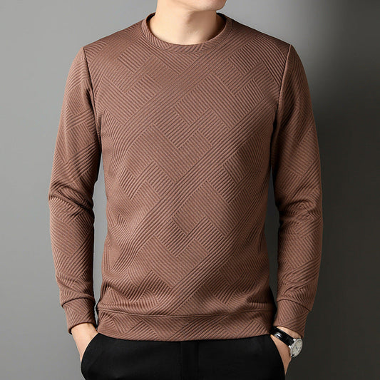 Maglia marrone a maniche lunghe con motivo geometrico, indossata da uomo. Design moderno, tessuto a trama, moda maschile autunno inverno.
