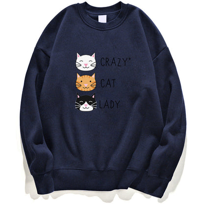 Felpa blu con stampa di tre gatti sorridenti e scritta "Crazy Cat Lady". Design divertente per amanti dei gatti. Moda casual e originale.