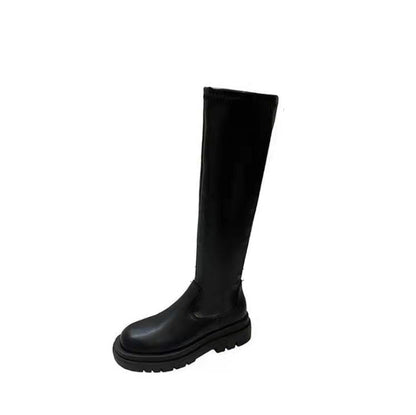 Stivale nero in pelle, design alto al ginocchio, suola spessa. Calzature moda autunno inverno, stile elegante e moderno.