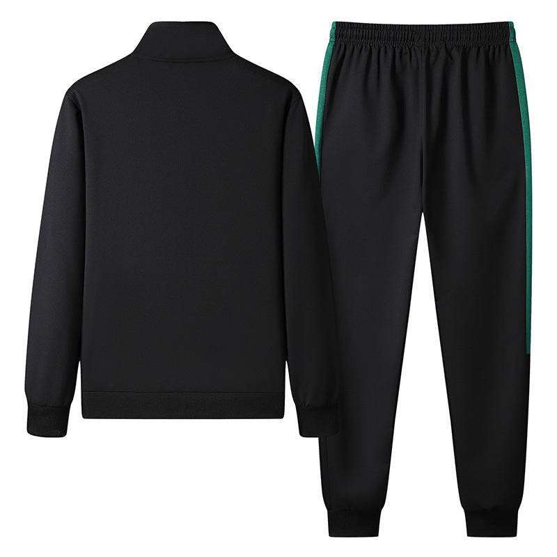 Tuta sportiva nera da uomo, giacca e pantaloni con dettagli verdi, abbigliamento casual, moda fitness, stile moderno, comodo e versatile.