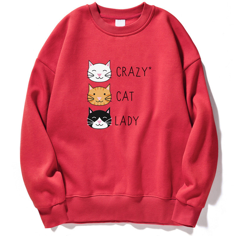 Felpa rossa con stampa di tre gatti sorridenti e la scritta "Crazy Cat Lady". Design casual, ideale per amanti dei gatti e moda streetwear.