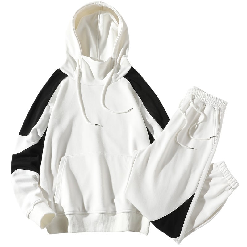 Set tuta sportiva bianca e nera, felpa con cappuccio e pantaloni, design moderno, abbigliamento casual unisex, moda streetwear.