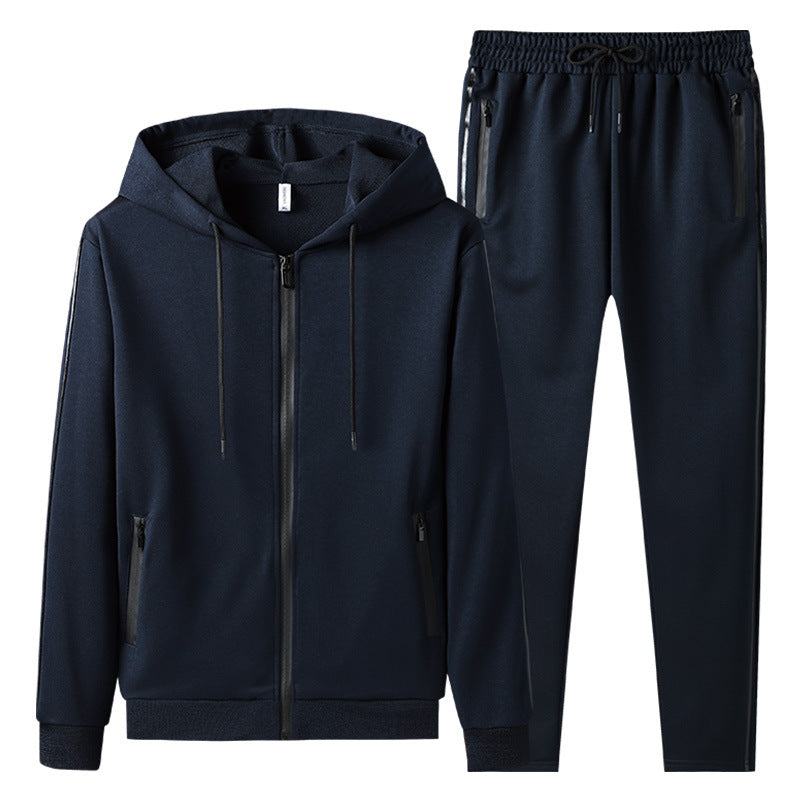 Tuta sportiva uomo blu scuro, felpa con cappuccio e pantaloni, chiusura zip, tasche laterali, abbigliamento casual, moda uomo, comfort e stile.