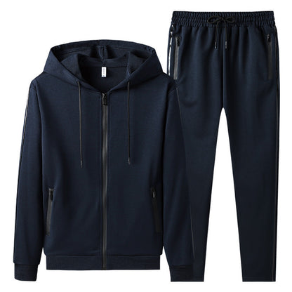 Tuta sportiva uomo blu scuro, felpa con cappuccio e pantaloni, chiusura zip, tasche laterali, abbigliamento casual, moda uomo, comfort e stile.