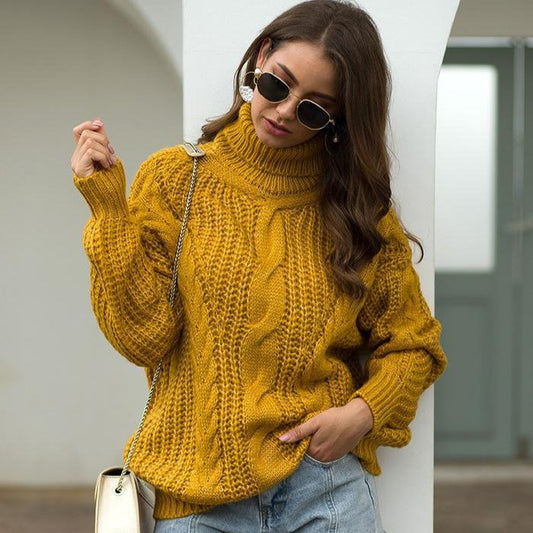 Donna con maglione giallo a trecce, occhiali da sole e borsa bianca. Moda autunnale, stile casual chic, tendenze abbigliamento femminile.