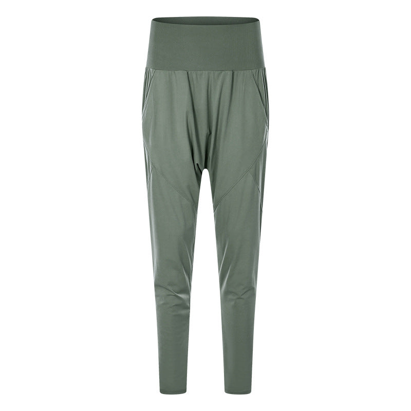 Pantaloni sportivi verdi da donna, vita alta, tessuto elastico, design moderno, ideali per yoga e fitness. Abbigliamento comodo e traspirante.