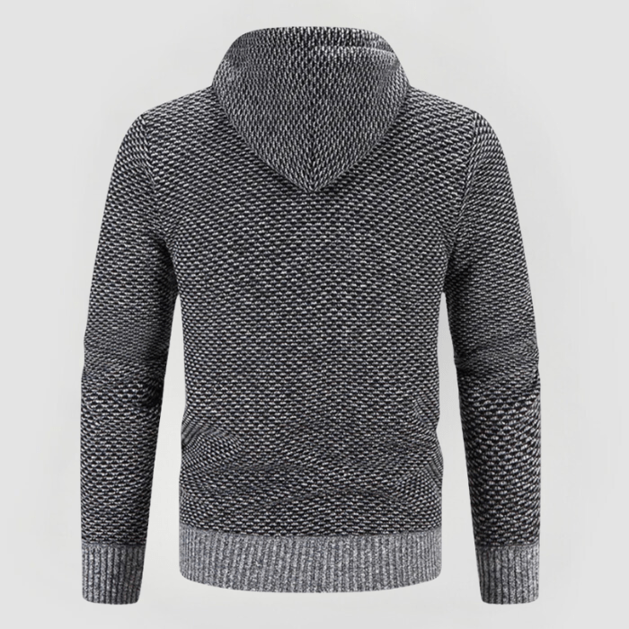 Felpa con cappuccio grigia a maglia, design a trama intrecciata, maniche lunghe, ideale per moda casual e comfort invernale.