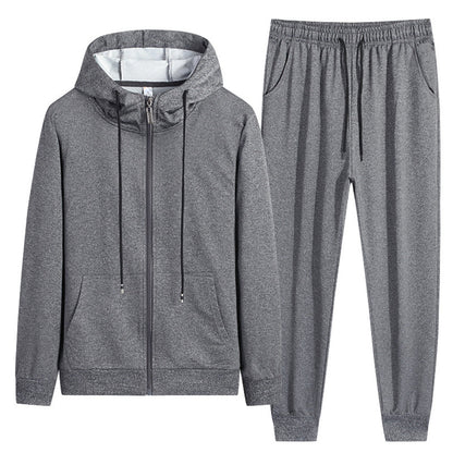 Tuta sportiva grigia in due pezzi, con felpa con cappuccio e pantaloni con coulisse. Abbigliamento casual unisex, ideale per palestra e tempo libero.