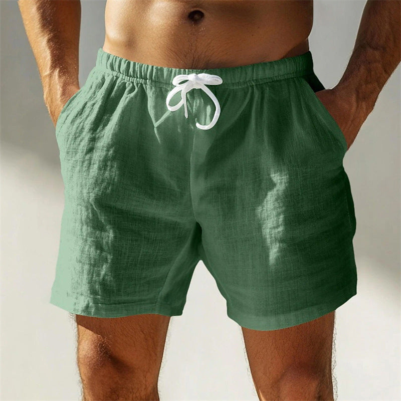 Shorts da uomo in lino verde, con tasche e laccio bianco in vita. Ideali per l'estate, moda casual, abbigliamento leggero e traspirante.