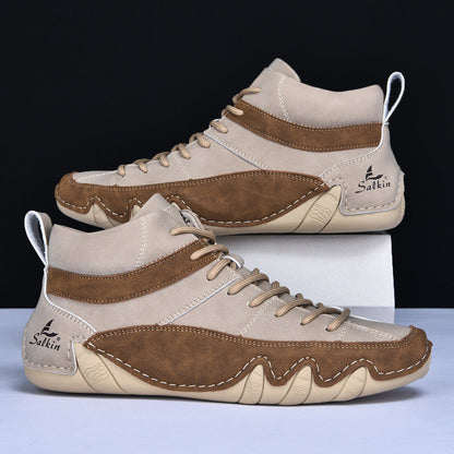 Scarpe da ginnastica alte in pelle marrone e beige, design moderno, suola antiscivolo, marchio Salkin visibile, adatte per sport e tempo libero.