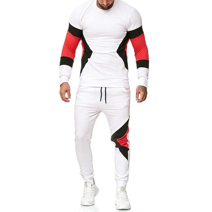 Tuta sportiva uomo bianca con dettagli rossi e neri, maniche lunghe, pantaloni con coulisse, stile moderno, abbigliamento fitness casual.
