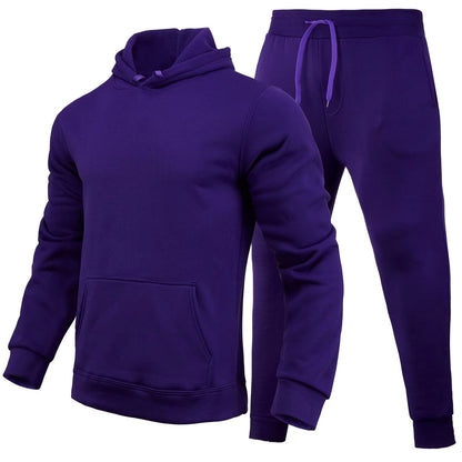 Tuta sportiva viola unisex, composta da felpa con cappuccio e pantaloni con coulisse. Abbigliamento casual, comodo e alla moda.