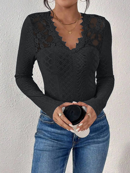 Top a maniche lunghe con scollo a V e pannelli in pizzo ideale per primavera