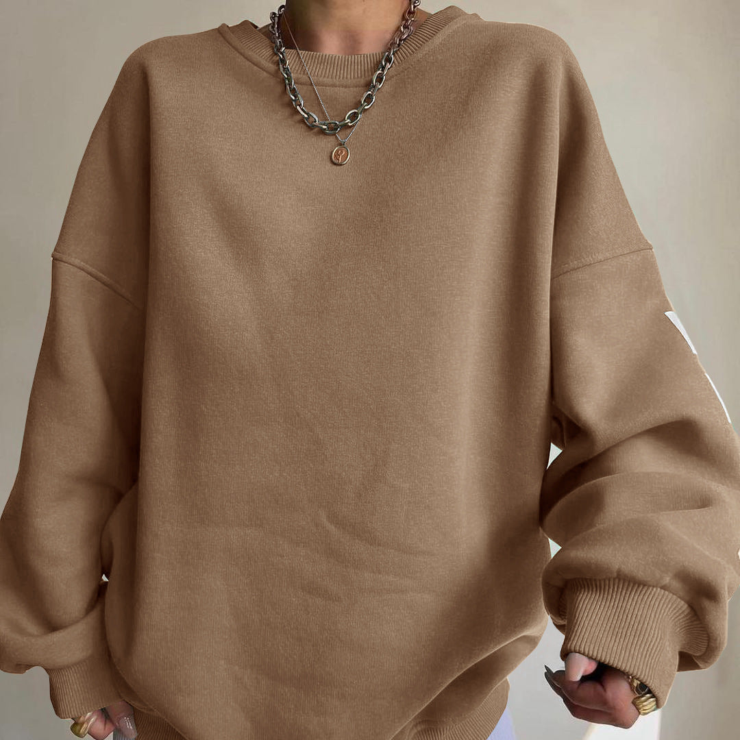 Langærmet dame top med print og rund hals