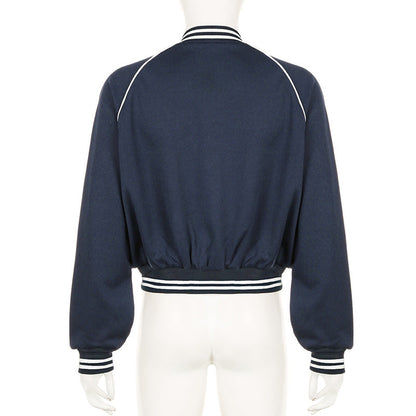 Giacca bomber blu scuro da donna, vista posteriore, con colletto e polsini a righe bianche. Design casual e sportivo, ideale per moda autunnale.