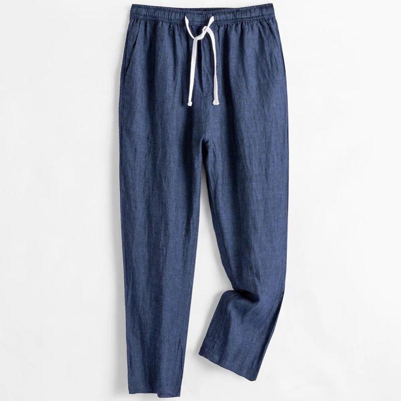 Pantaloni in lino blu con coulisse bianca, stile casual, perfetti per l'estate. Tessuto leggero e traspirante, ideale per look rilassati.