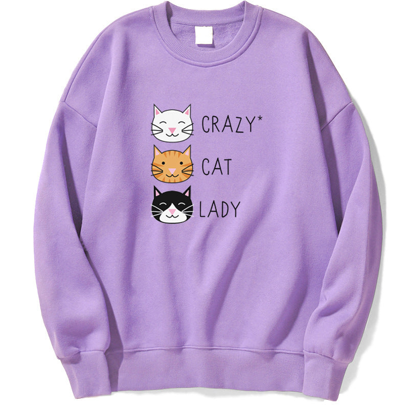 Felpa viola con stampa "Crazy Cat Lady" e tre gatti stilizzati. Abbigliamento casual, moda felpe, design gatti, stile unico.