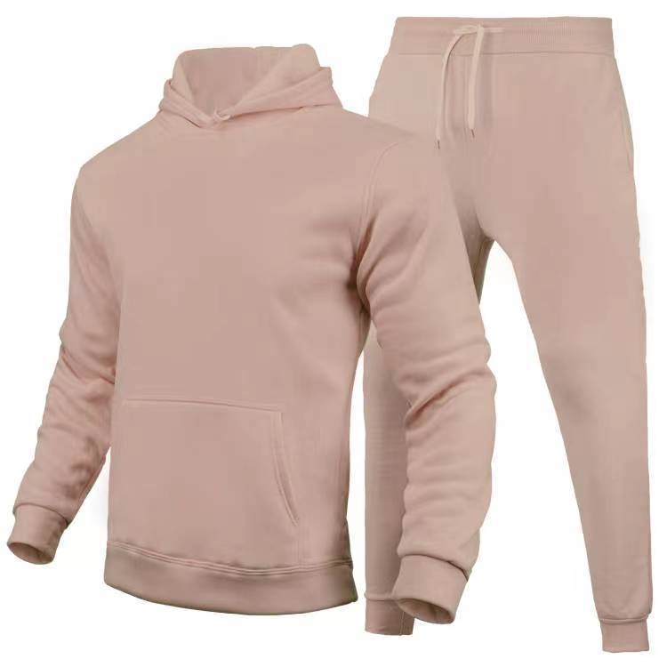 Set tuta sportiva unisex color rosa chiaro, composto da felpa con cappuccio e pantaloni con coulisse. Abbigliamento casual comodo e alla moda.