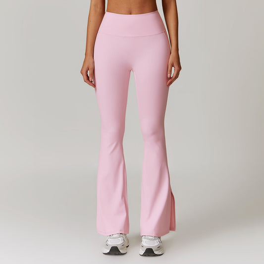 Pantaloni a zampa rosa da donna, vita alta, tessuto elasticizzato, ideali per yoga o fitness. Scarpe da ginnastica bianche incluse.