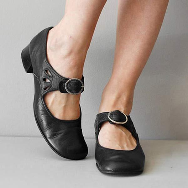 Scarpe nere da donna con cinturino e tacco basso, design elegante e comodo, ideali per abbigliamento casual o formale.