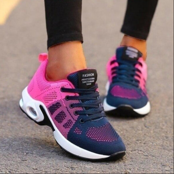 Scarpe da ginnastica donna, design moderno, colori rosa e blu, suola ammortizzata, ideali per corsa e sport, moda calzature sportive.