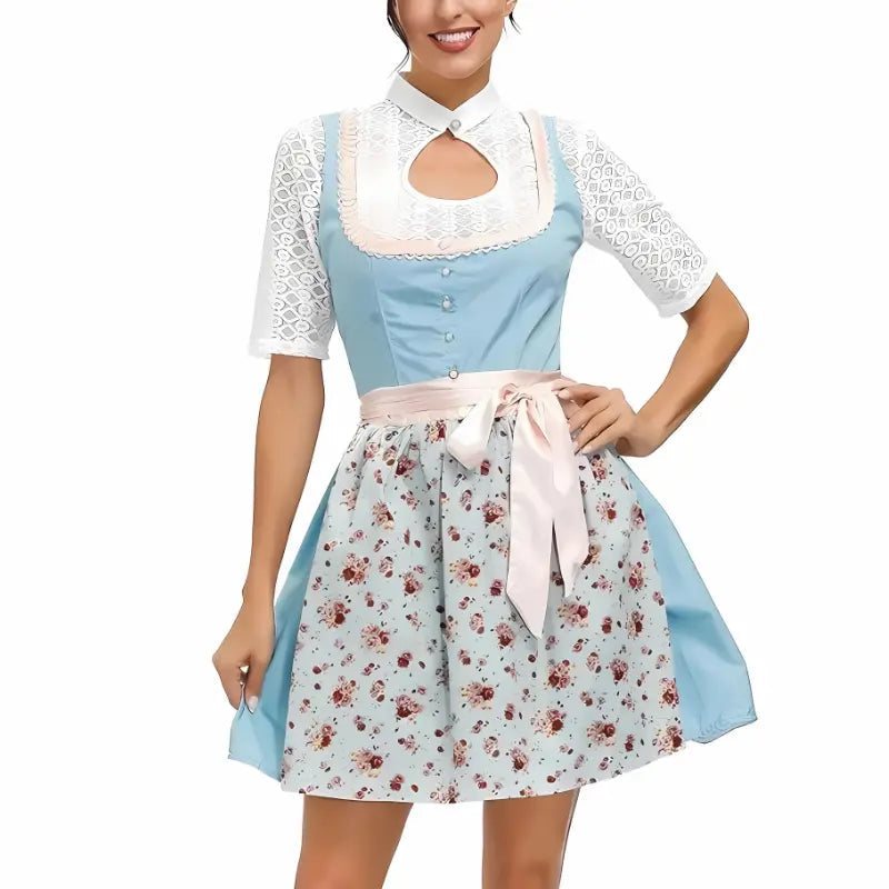 Abito tradizionale bavarese per donna, con corpetto azzurro, camicetta bianca in pizzo e gonna floreale. Perfetto per Oktoberfest e feste a tema.