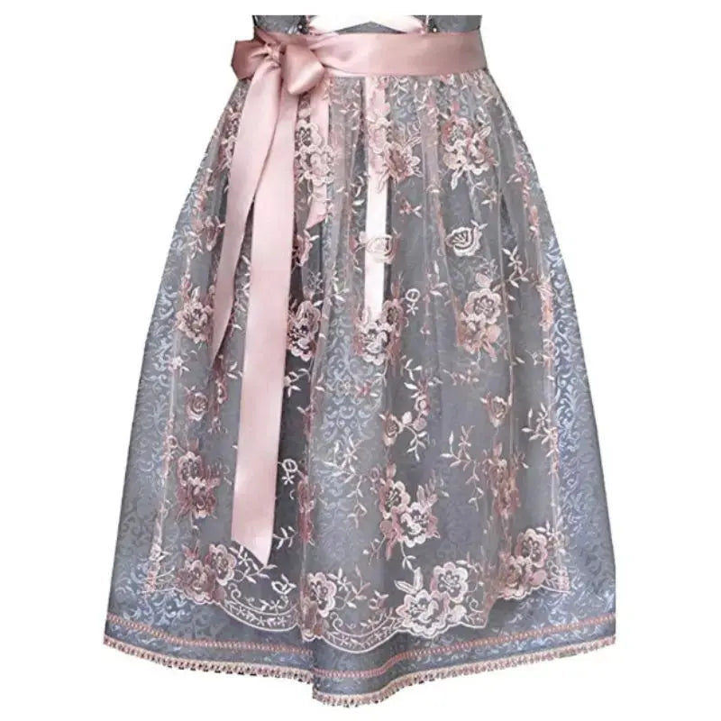 Gonna in tulle trasparente con ricami floreali rosa e fiocco in raso, elegante e femminile, perfetta per eventi speciali e cerimonie.