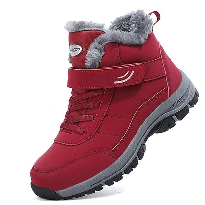 Scarponcino invernale rosso con fodera in pelliccia sintetica, suola antiscivolo e chiusura a strappo. Ideale per escursioni e attività all'aperto.