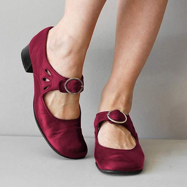Scarpe rosse da donna con tacco basso e cinturino, design elegante e comodo, ideali per moda casual e occasioni speciali.