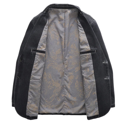 Giacca nera aperta con fodera interna grigia decorata, tasche interne, bottoni laterali. Elegante e versatile per moda uomo.