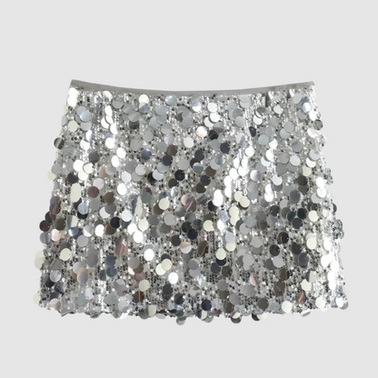 Minigonna argento con paillettes scintillanti, moda donna, abbigliamento elegante, stile glamour, perfetta per feste e serate speciali.