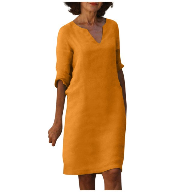 Abito arancione a maniche lunghe, scollo a V, stile casual elegante. Vestito donna moda autunno, tessuto leggero, design minimalista.