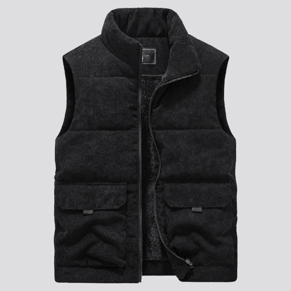 Gilet imbottito nero in velluto a coste, senza maniche, con tasche frontali e zip, ideale per moda autunnale e invernale.
