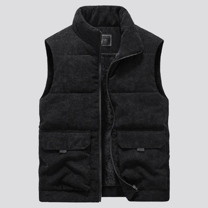 Gilet imbottito nero in velluto a coste, senza maniche, con tasche frontali e zip, ideale per moda autunnale e invernale.