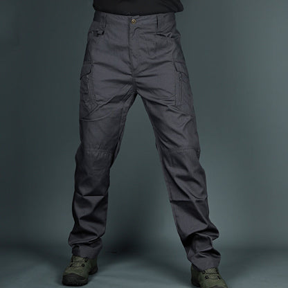 Pantaloni tattici grigi da uomo, resistenti e multifunzionali, con tasche laterali, ideali per attività outdoor e avventure all'aperto.