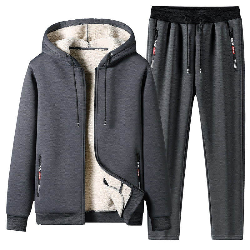 Tuta sportiva invernale grigia, felpa con cappuccio foderata in pile e pantaloni abbinati, ideale per attività all'aperto e tempo libero.