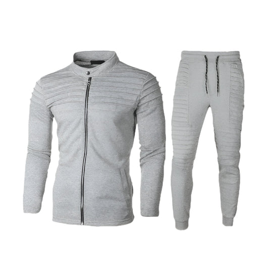 Tuta sportiva grigia da uomo, giacca con zip e pantaloni con coulisse, design moderno a coste, abbigliamento casual e comodo per palestra e tempo libero.