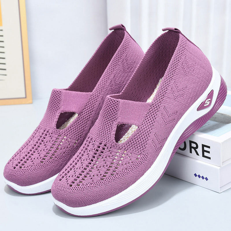 Scarpe da ginnastica viola in maglia traspirante, suola bianca antiscivolo, design slip-on, ideali per sport e tempo libero.